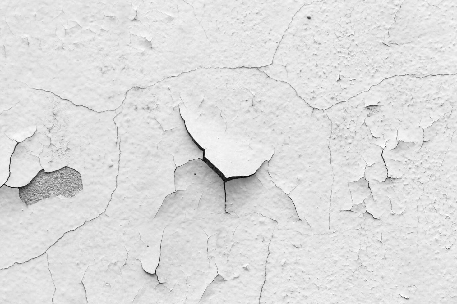 white wall with cracks photo
