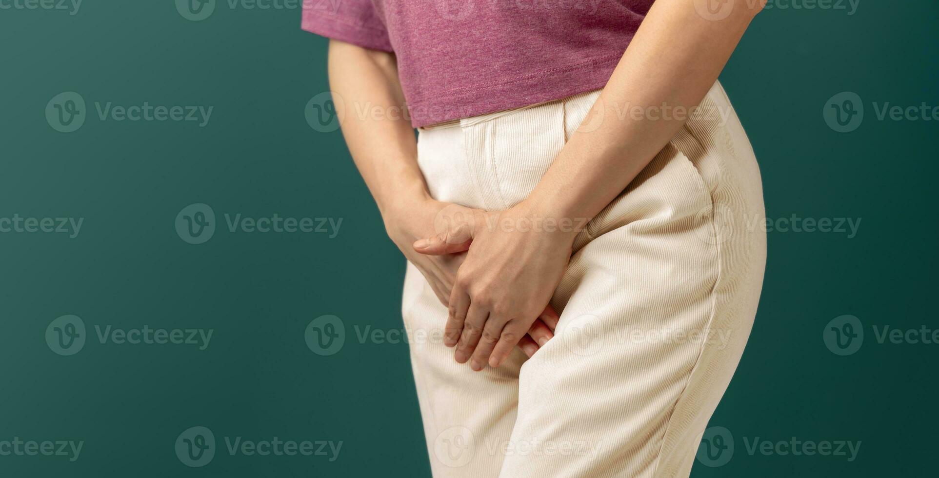 Women using Hands to Cover the Itchy area between their legs. Odor Smell Problems. Female Sexual Health. Infection from Sexually Transmitted Diseases.Irregular Menstruation. Urinary Incontinence photo