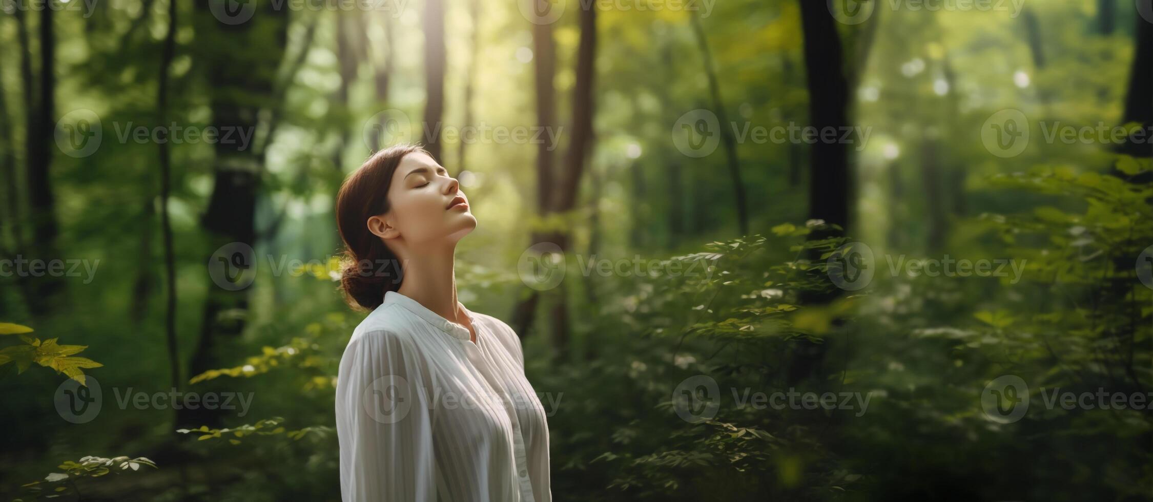 Harmony, Close to Nature Concepts, a Young Female Take Deep Breathing Fresh Air in the Green Forest Woods. Engaging Body and Mind with Nature, Eyes Closed. Concept of Calm, Meditation. photo