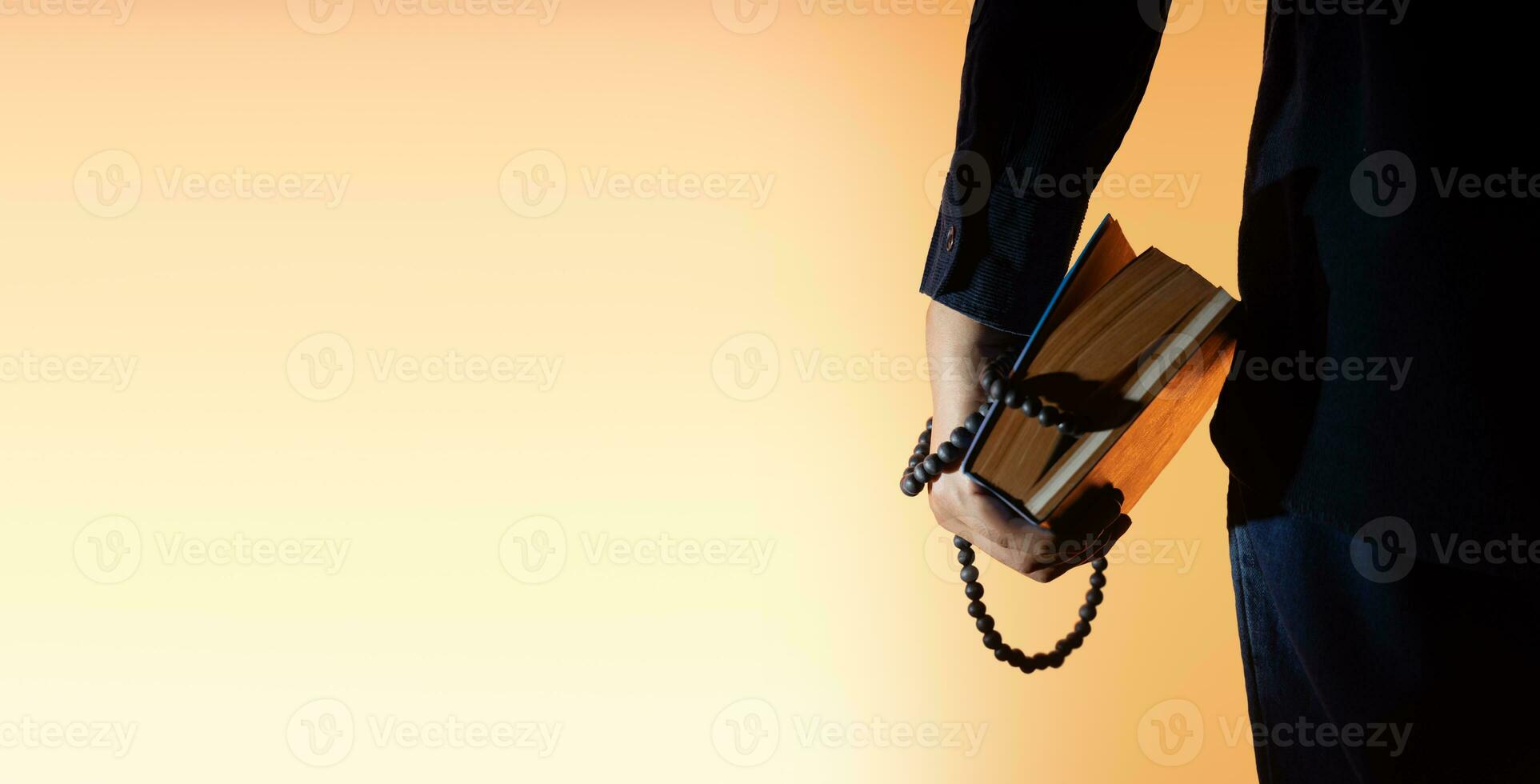 Spirituality, Religion and Hope Concept. Person Holding a Holy Bible and Bead. Symbol of Humility, Supplication, Believe and Faith for Christian People photo