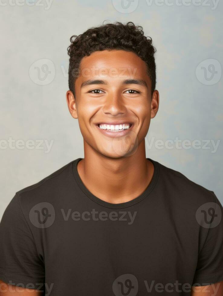 Smiling young man of Mexican descent against neutral background AI Generative photo