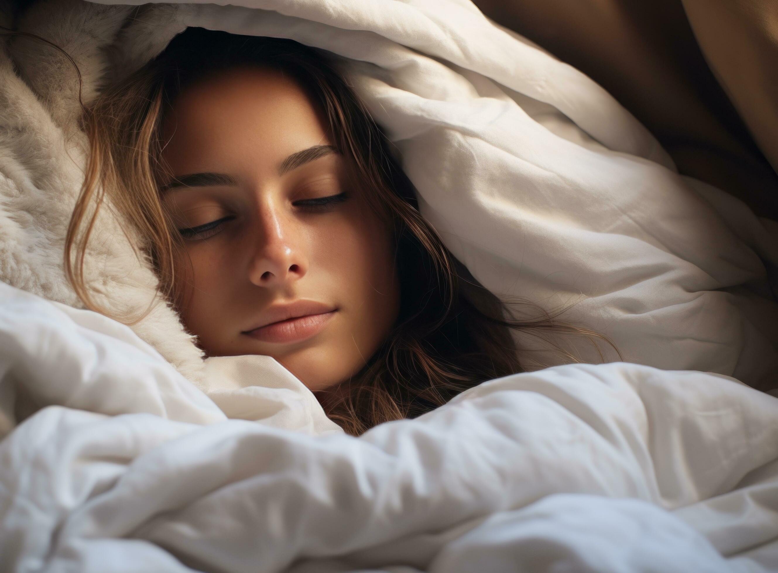 young woman sleeping under a white blanket in a bed 31530766 Stock Photo at Vecteezy