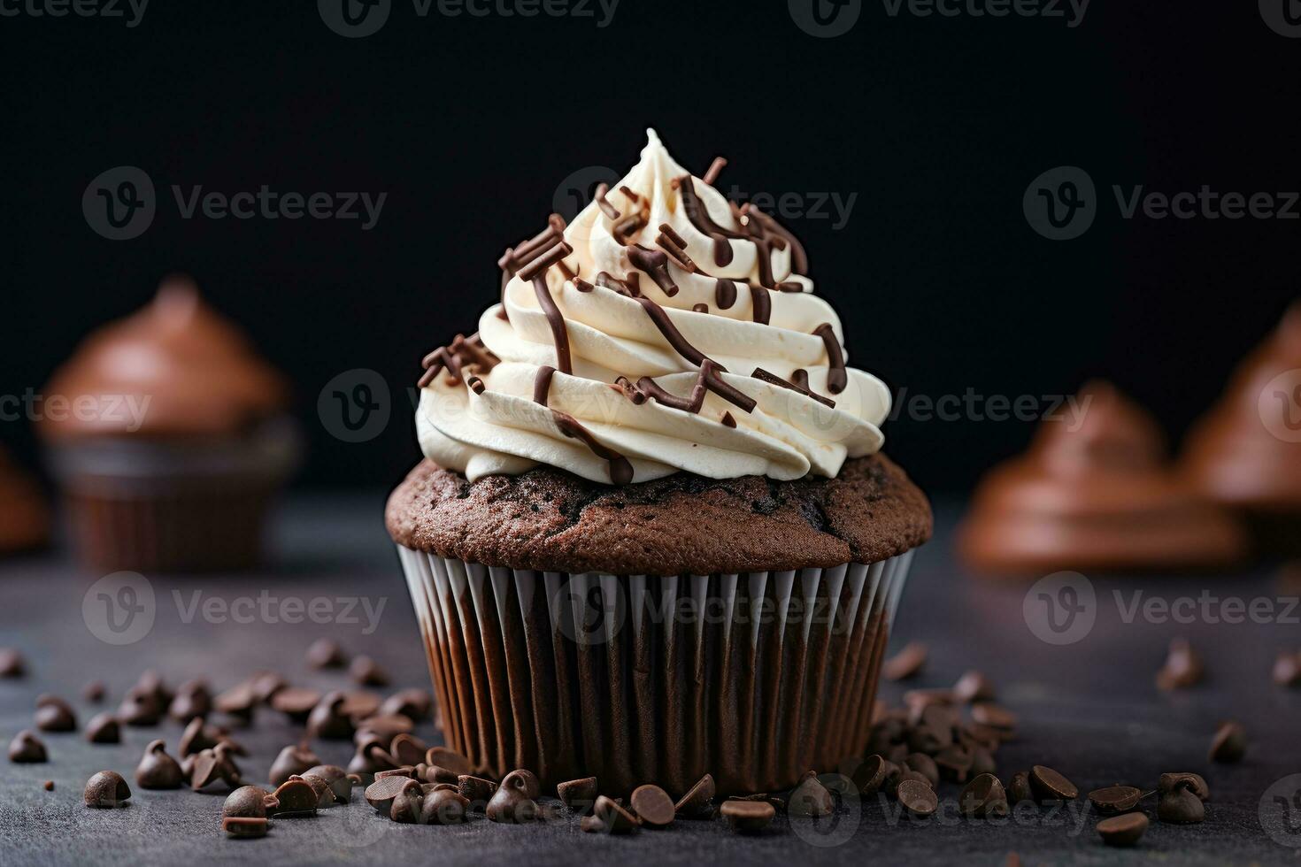A chocolate cupcake with cottage cheese cream and chocolate chips