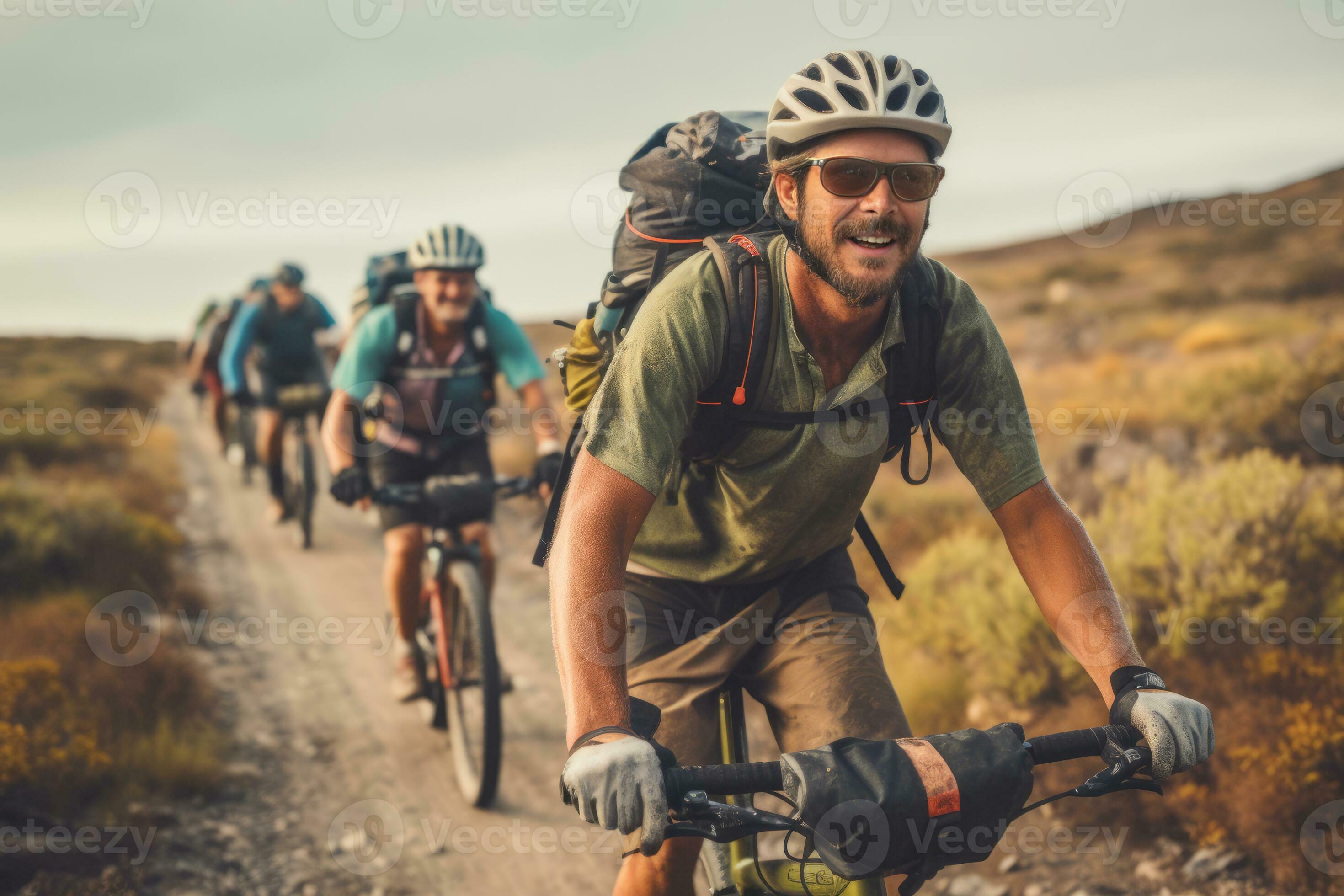 A group of cyclists riding together exploring diverse terrains and A group of cyclists riding together exploring diverse terrains and