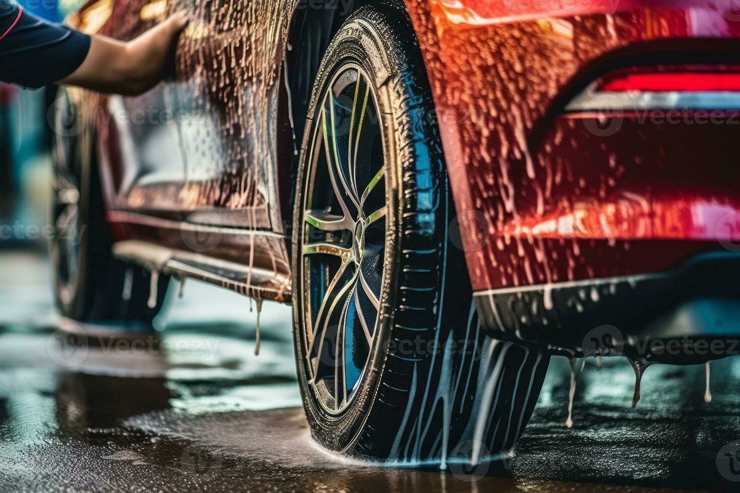 A close-up of a car tire being carefully cleaned and dressed by a detailer, showcasing the attention given to every aspect of the car during the wash. Generative AI photo