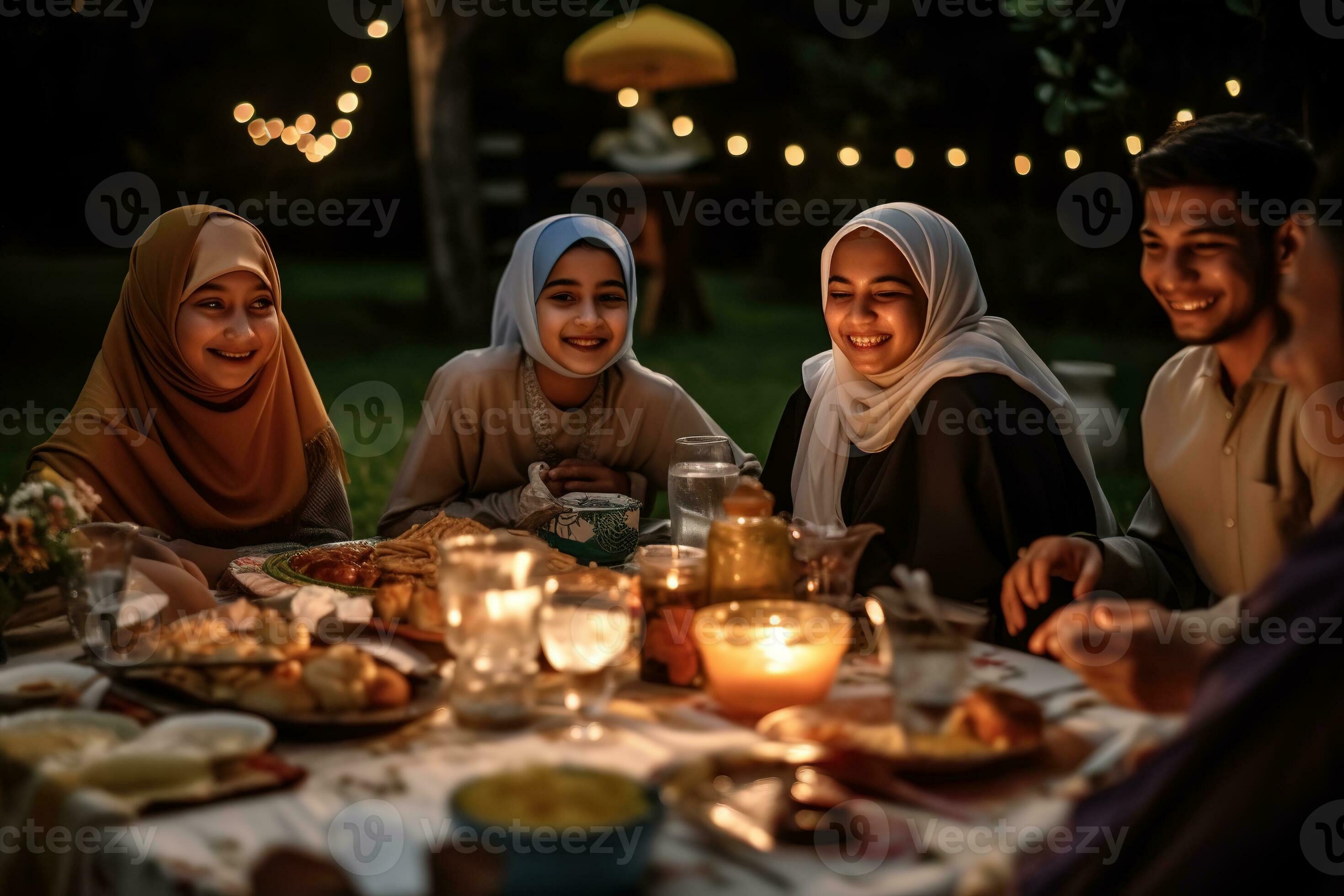 A family sitting together for iftar the breaking of fast at sunset On A family sitting together for iftar the breaking of fast at sunset On