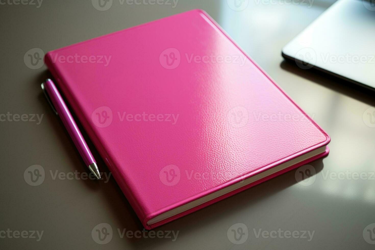 A pink notebook with a pen is lying on the desktop. AI generated photo