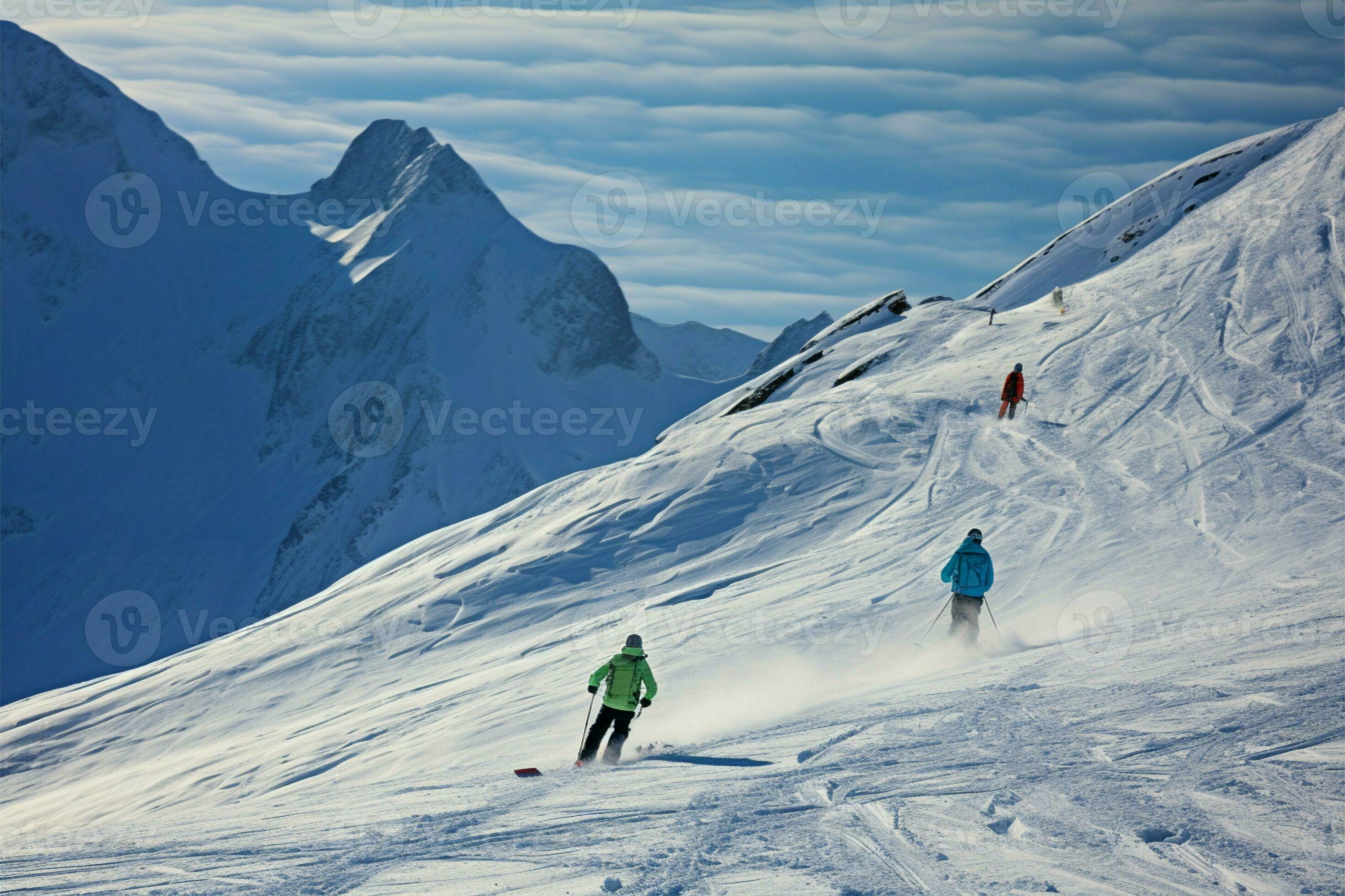 Skiers navigating the pristine snow covered slopes of the majestic Alps 