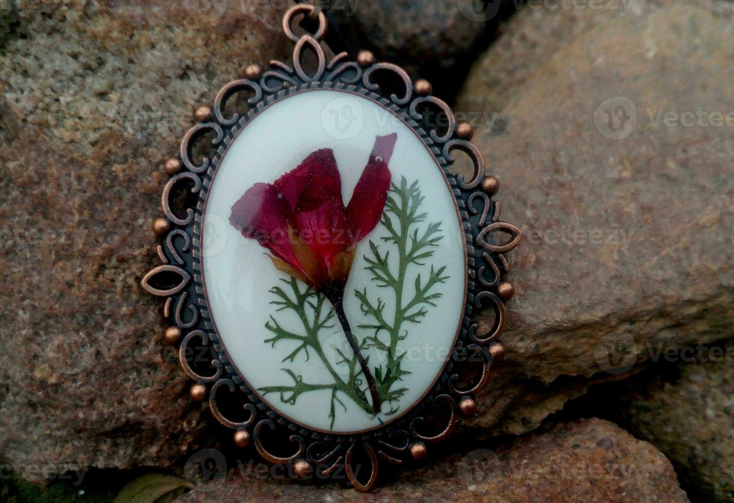 elegant handmade resin jewelry, pressed flowers of geranium in epoxy resin photo