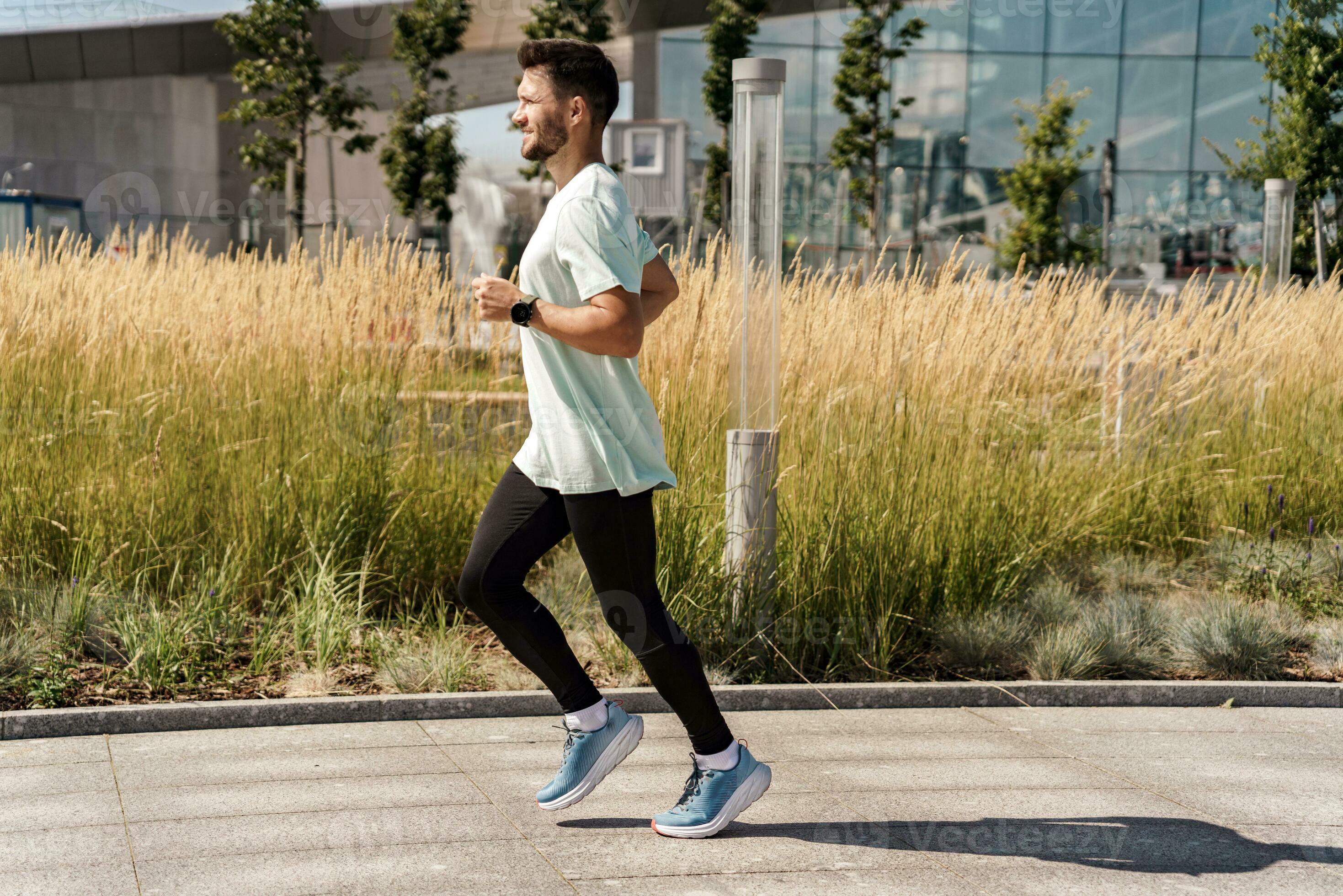 A runner does exercise every day, a healthy lifestyle. A man training  fitness in a comfortable T-shirt. A sporty man jogging in sneakers.  31603747 Stock Photo at Vecteezy