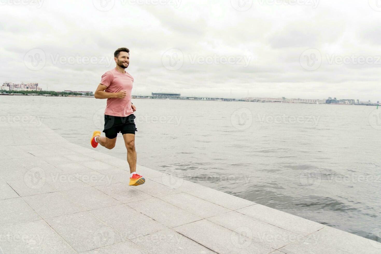 Motivation men engaged in fitness train.  A person is a runner using a smartwatch for fitness, sportswear and running shoes.   Athlete training plank in sportswear. photo