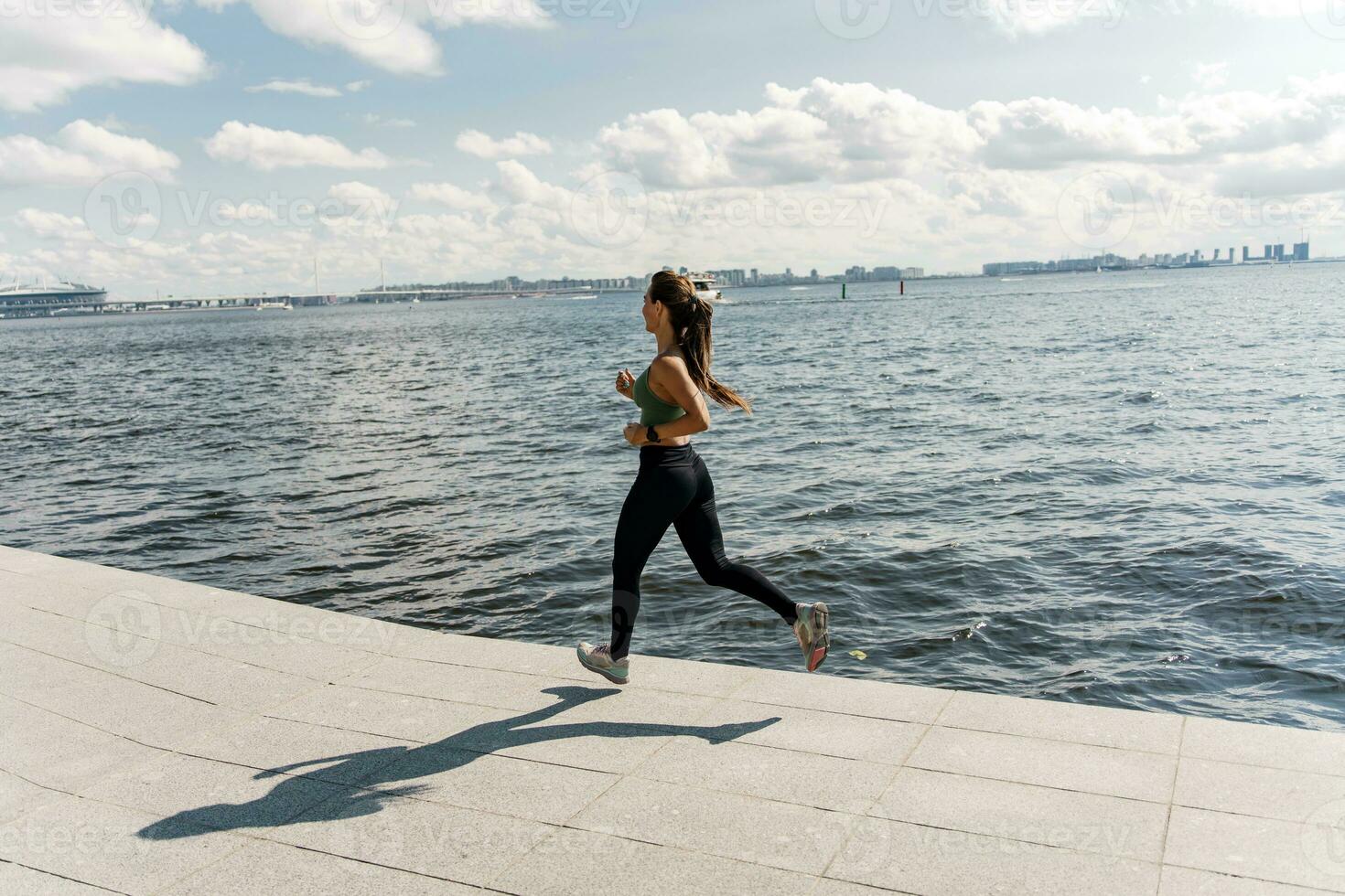 Motivation women engaged in fitness train. A person is a runner using a smartwatch for fitness, sportswear and running shoes.    Athlete training in sportswear. photo