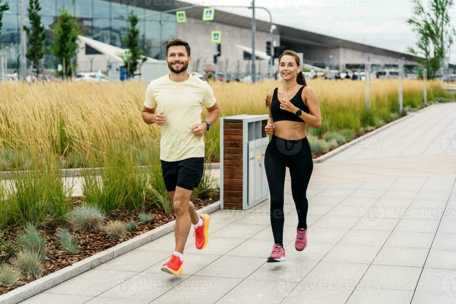 Friends are fitness people who train together.  Runners are getting ready for the race. Using smart watches for fitness, sportswear and running shoes. photo