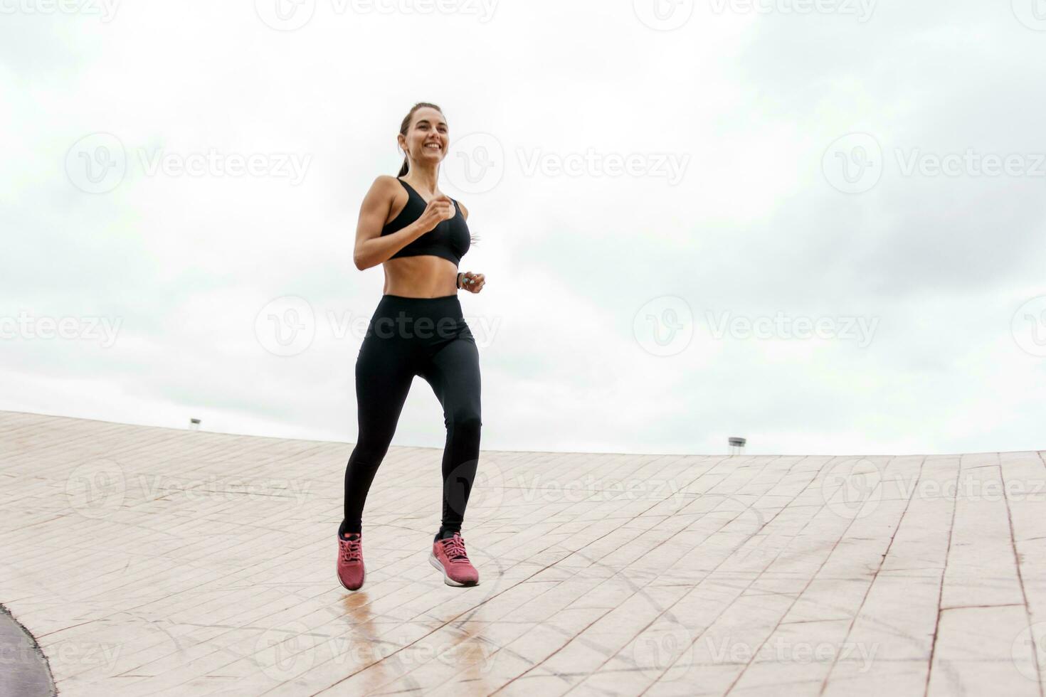 Coach running athlete woman train in the fresh air. Runners are getting ready for a run. Fitness exercises for a healthy lifestyle. Use a fitness watch and  sports. photo