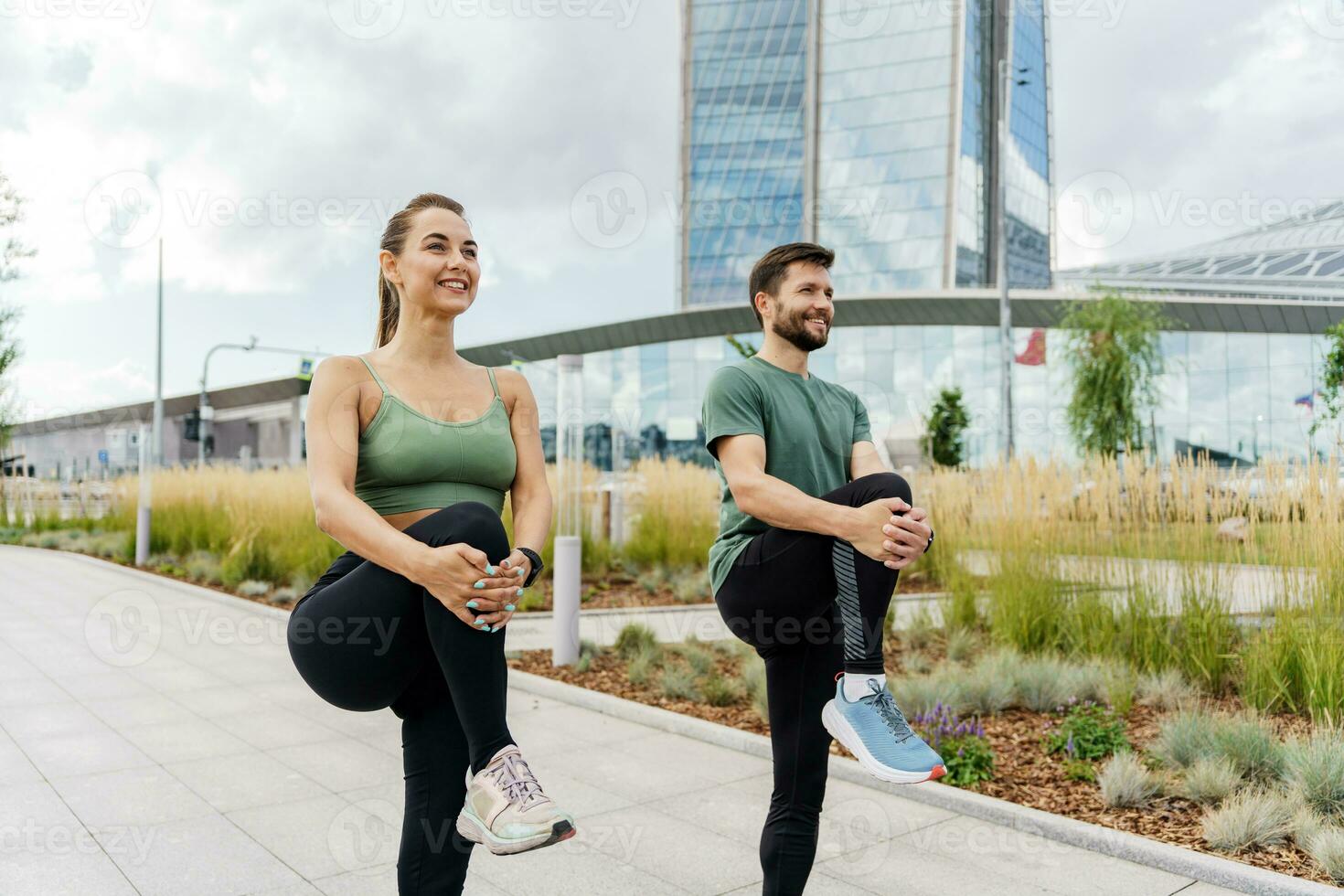 Friends are fitness people who train together. Using smart watches for fitness, sportswear and running shoes. Runners are getting ready for the race. photo