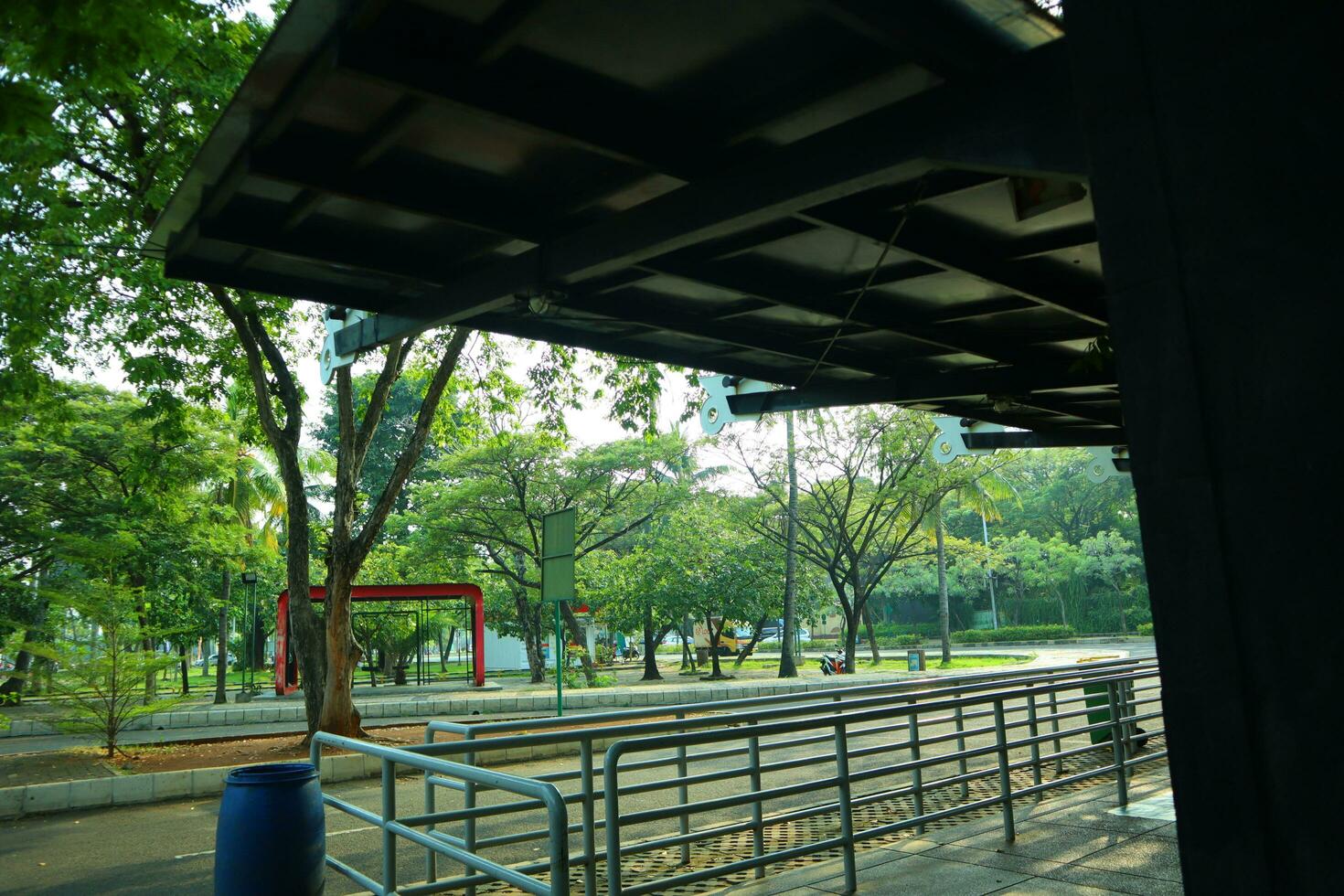 empty bus stop. midday. no vehicles photo