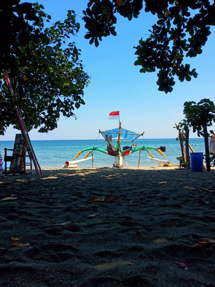 traditional fishing boats on the beach, very suitable for tourism promotion photo