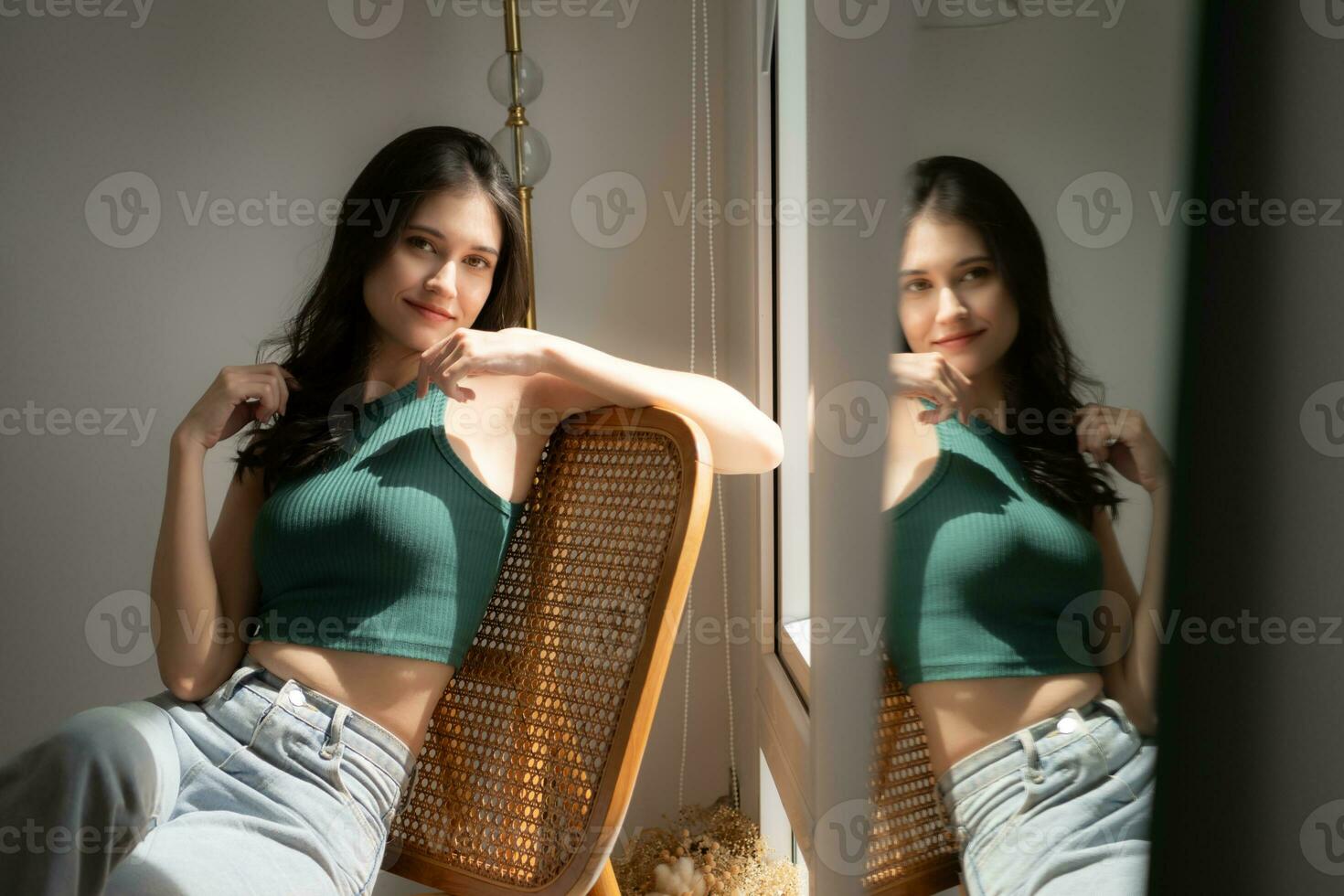 Beautiful asian woman sitting on chair and looking out the window photo
