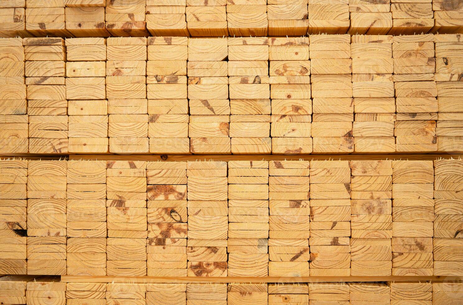 Wooden stacked in a warehouse, close-up. Wooden industrial background photo