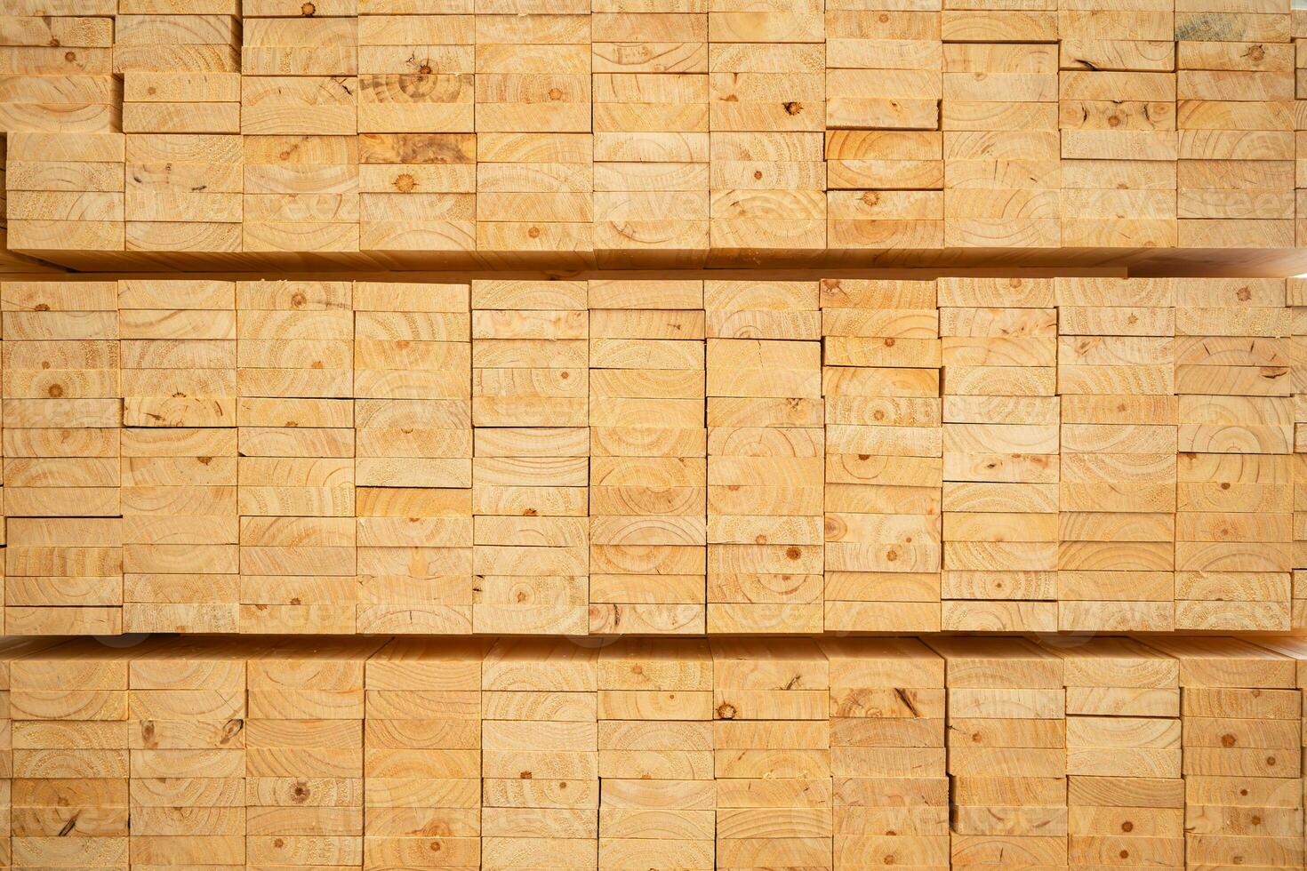 Wooden stacked in a warehouse, close-up. Wooden industrial background photo