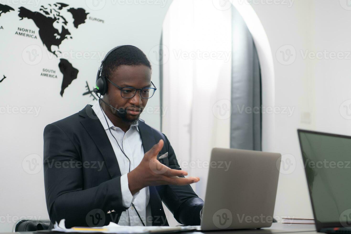 Portrait of business people wearing headset working actively in office. Call center, telemarketing, customer support agent provide service on telephone video conference call. photo