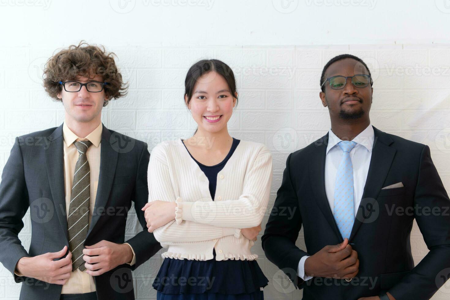 Portrait of confident business team standing in office. Multiethnic group. photo