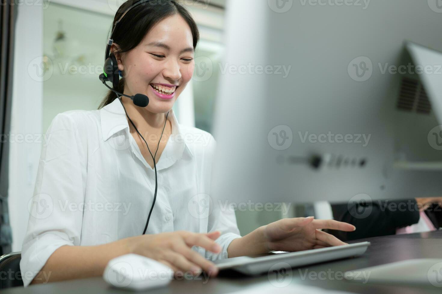 Portrait of business people wearing headset working actively in office.  Call center, telemarketing, customer support agent provide service on telephone  video conference call. 31608287 Stock Photo at Vecteezy