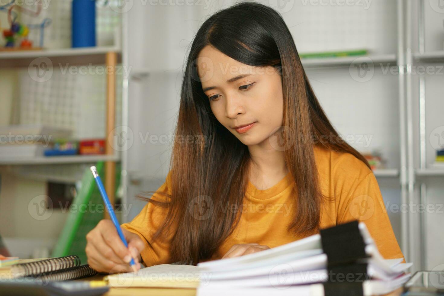 Asian women bring home work photo