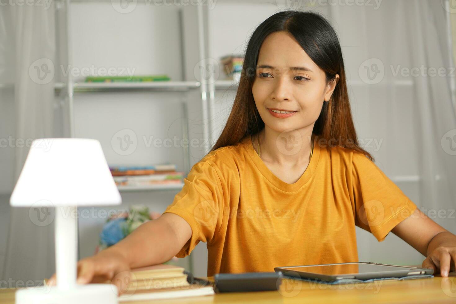 Asian women bring home work photo