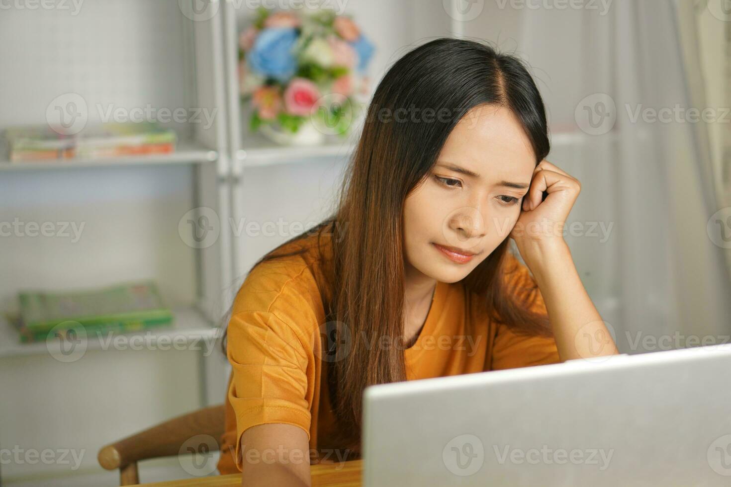 Asian woman working from home Tired of paperwork that is not completed on time photo