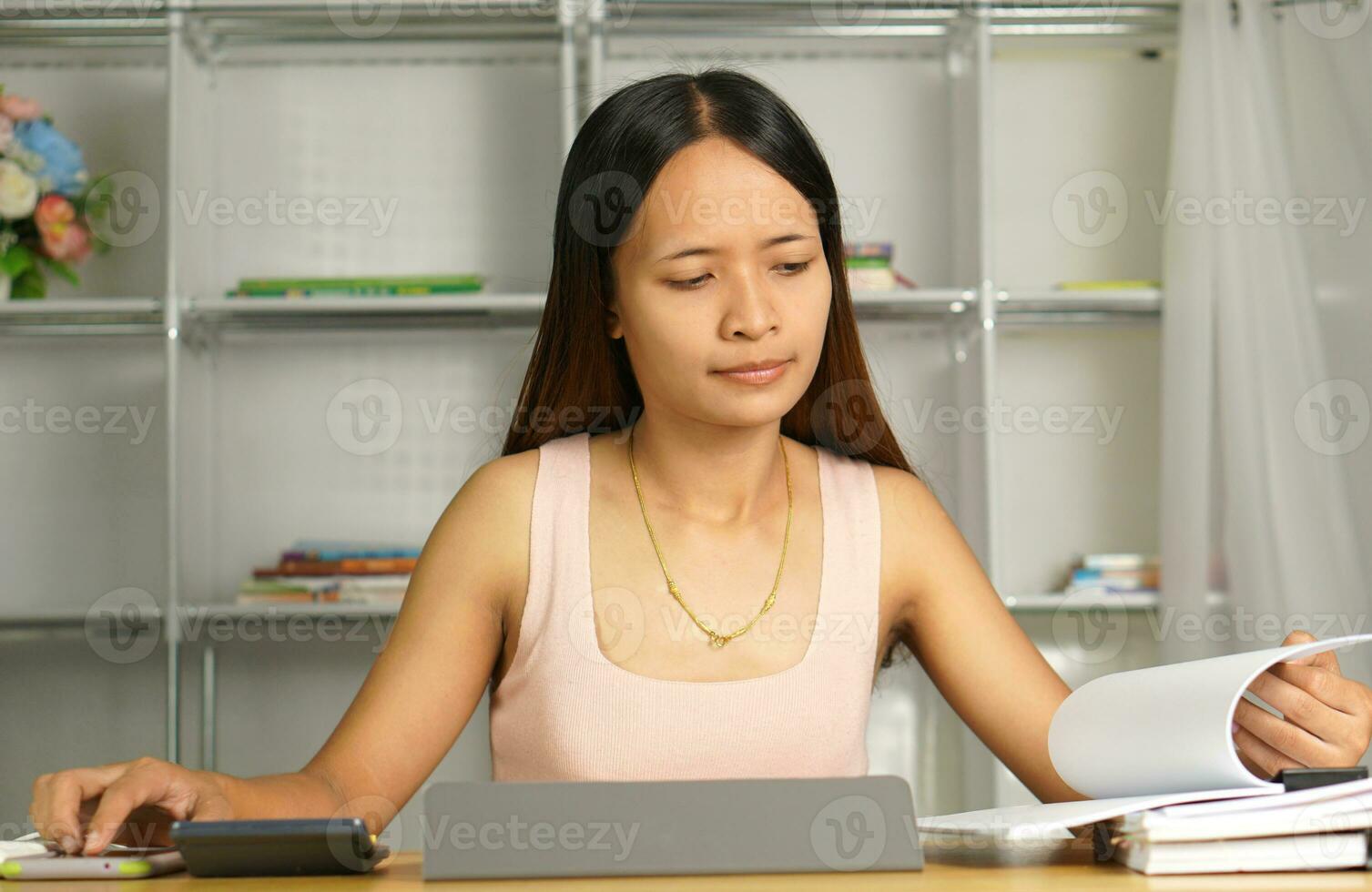 Asian women bring home work photo