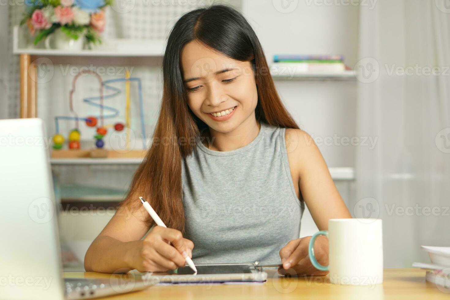 business woman working from home Use a computer to contact the team. photo