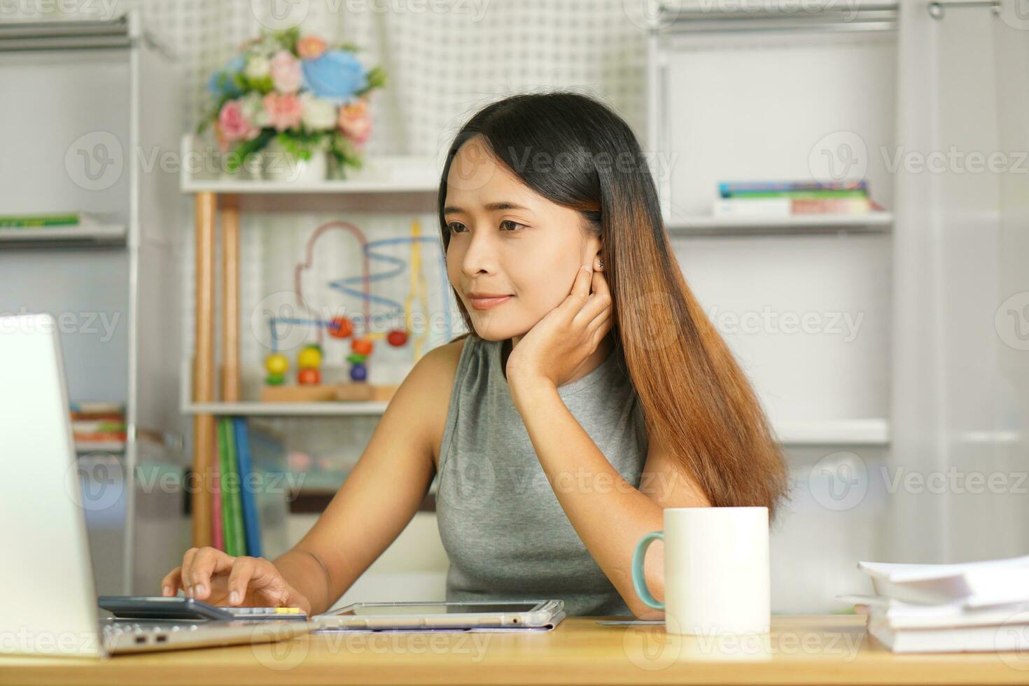 business woman working from home Use a computer to contact the team. photo