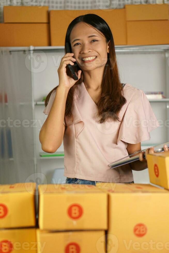 Online sellers answer phone calls from customers with large orders and respond to computer messages. photo