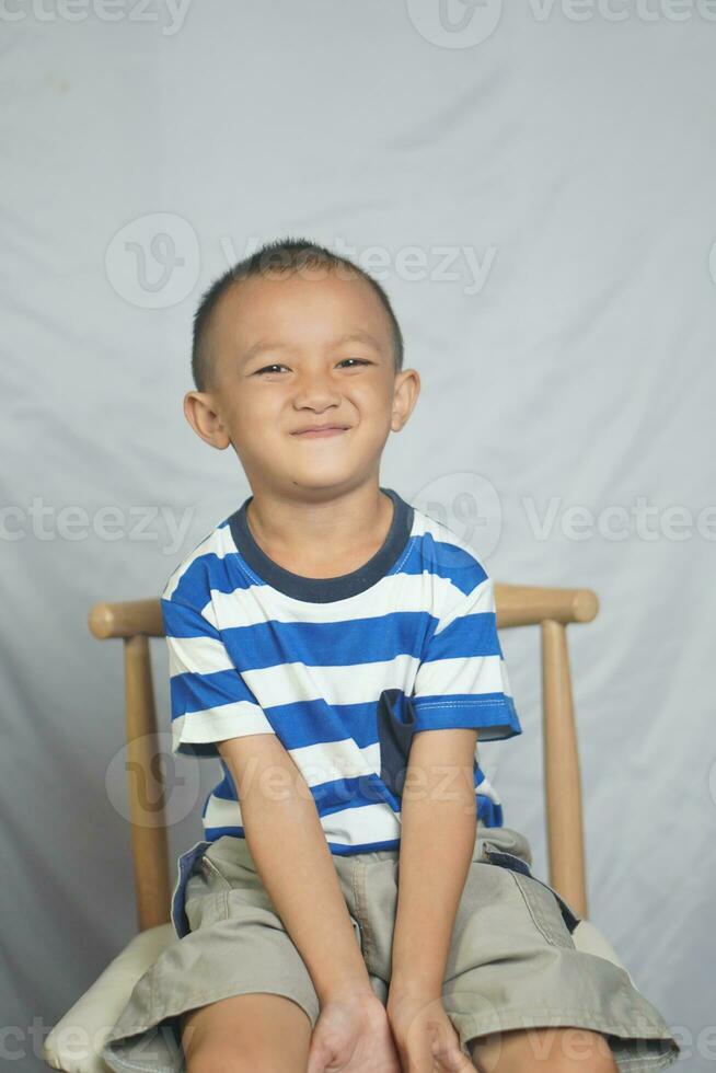 Happy boy in photo studio smile and laugh