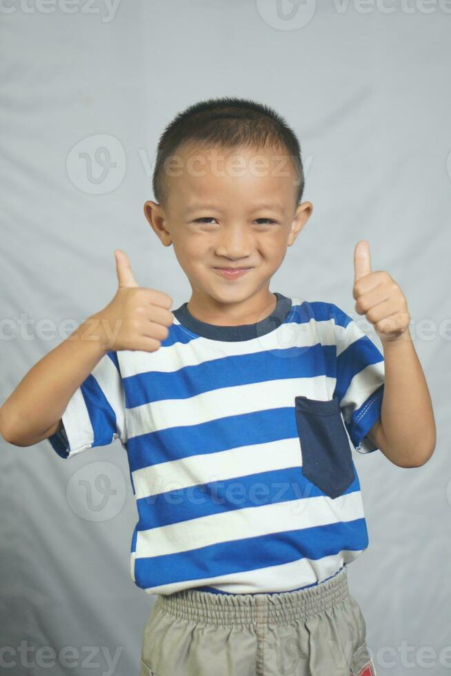 The boy laughed and smiled happily. photo