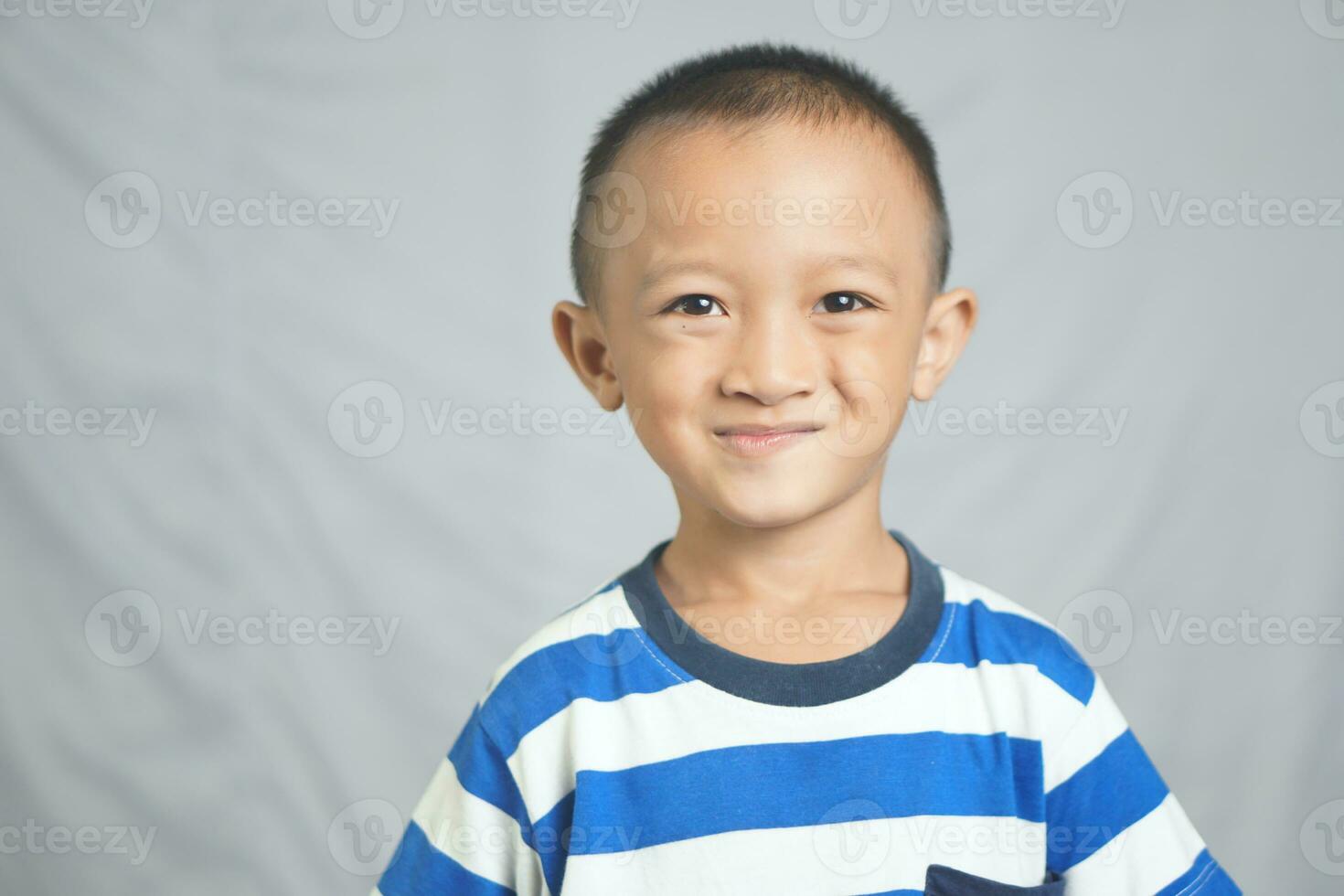 Asian boy gets excited when he sees something photo