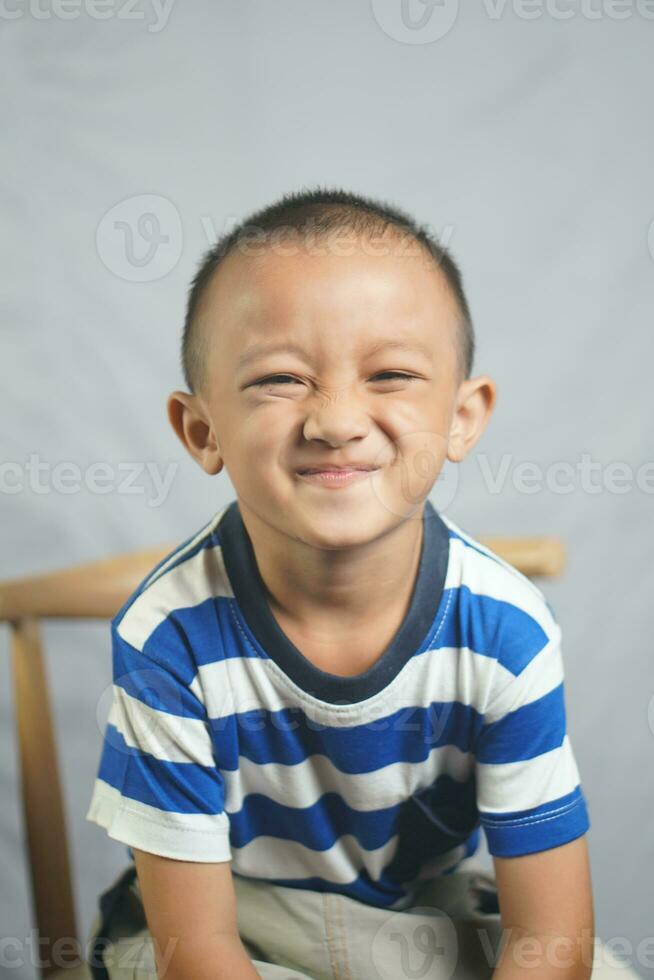Happy boy in photo studio smile and laugh