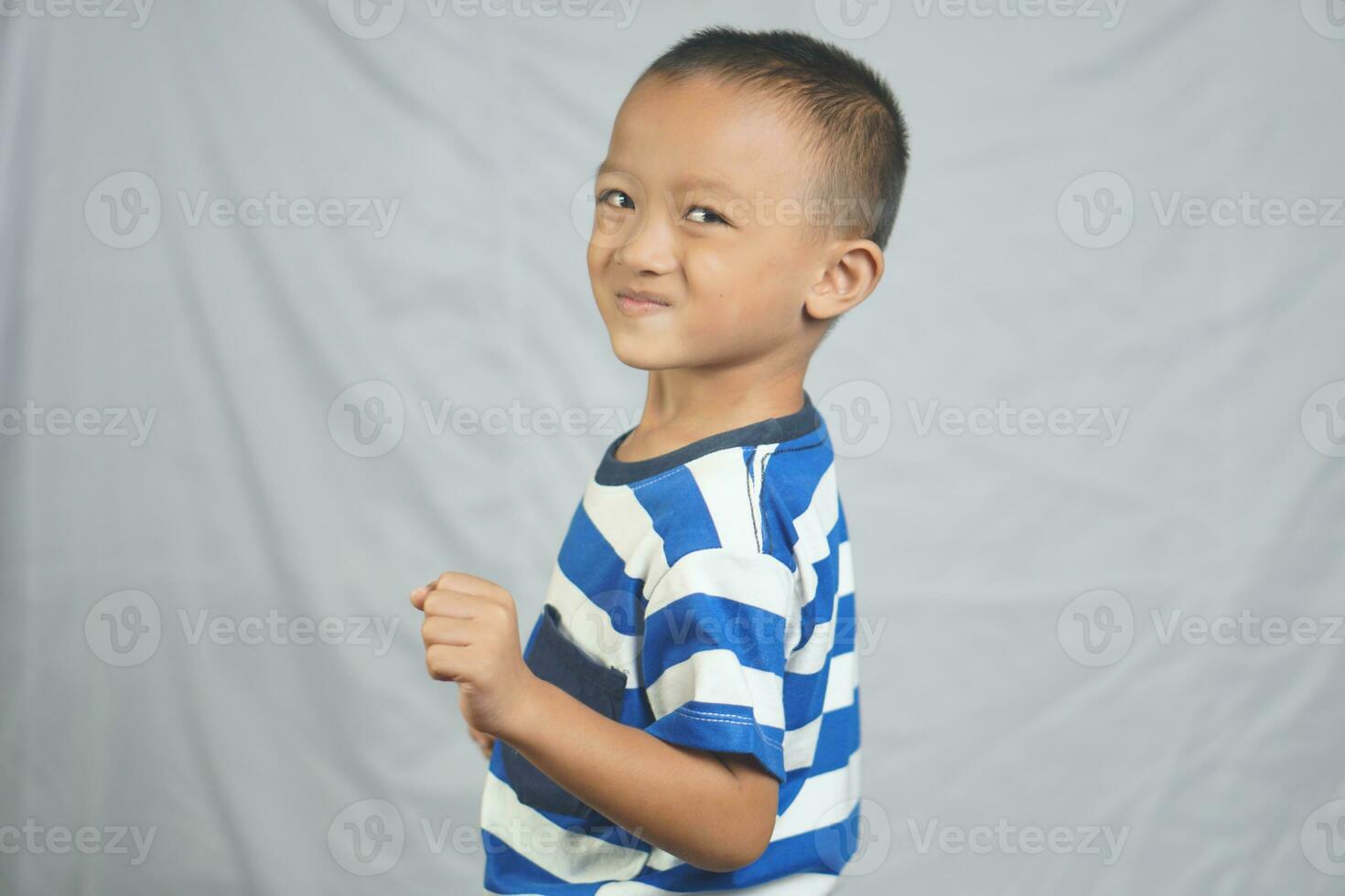 Asian boy smiling, laughing, happy photo