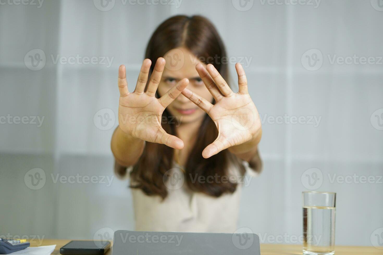 Asian woman working at home Scold the employee for making a mistake. Don't make that mistake again. photo
