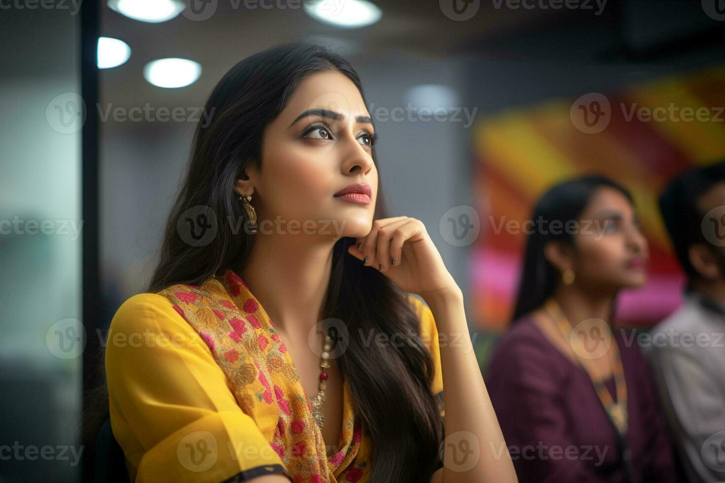 A photo of a female worker sitting in her office on diwali looking away from the camera, ai generative