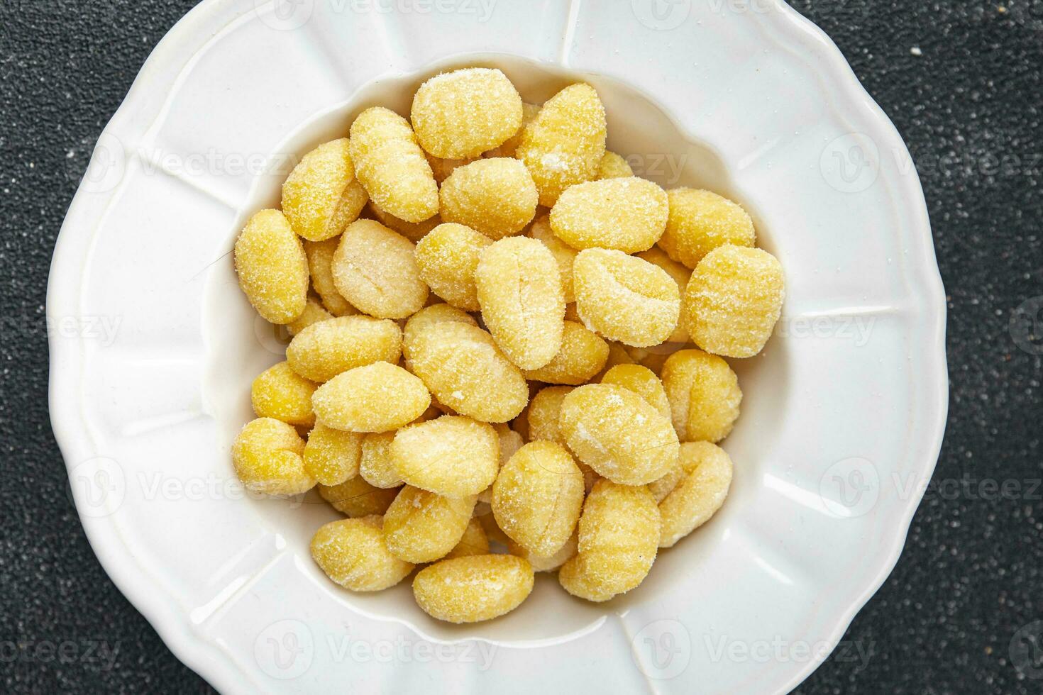 gnocchi raw food potato snack meal food on the table copy space food background rustic top view photo