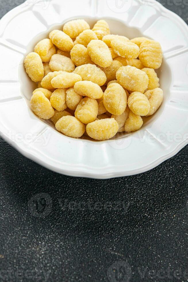 gnocchi raw food potato snack meal food on the table copy space food background rustic top view photo