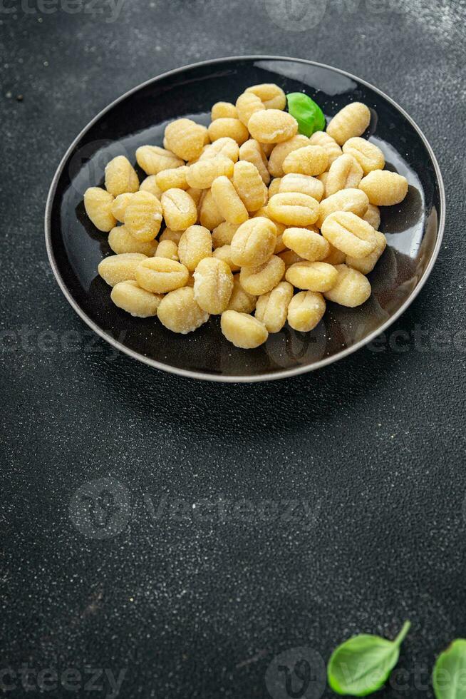 gnocchi raw food potato snack meal food on the table copy space food background rustic top view photo