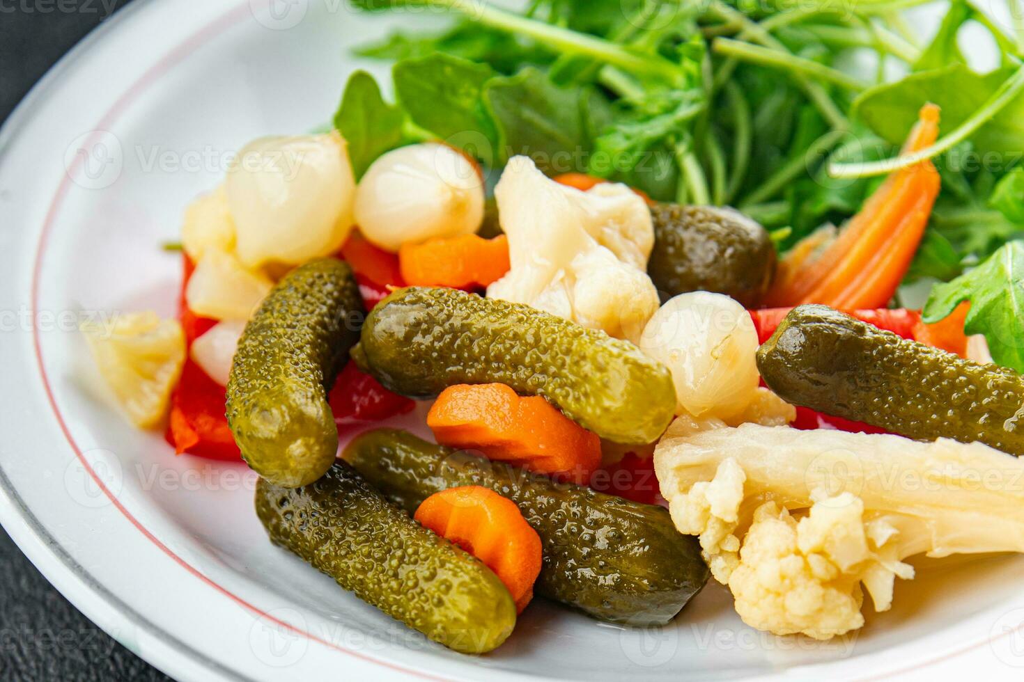 vegetables pickled salad spicy cucumber, gherkin, carrot, onion, cauliflower, pepper appetizer meal food snack on the table copy space food background rustic top view photo