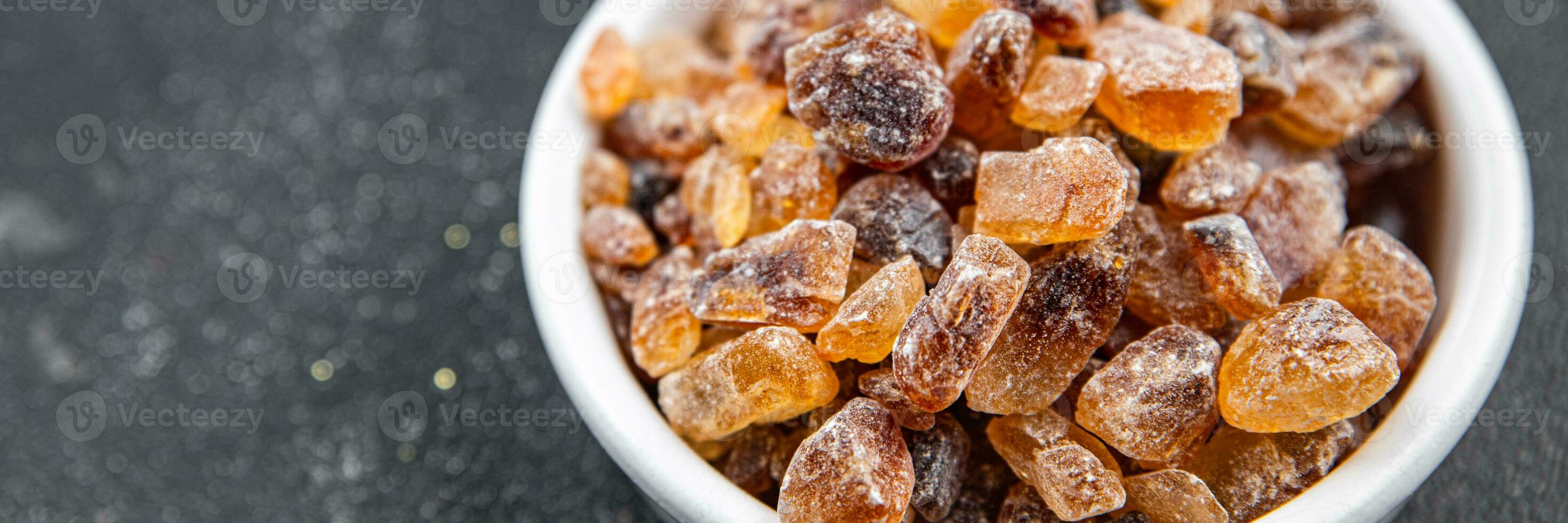 rock sugar crystals pieces candy brown sugar candied big rock caramel taste cane sugar healthy eating cooking appetizer meal food snack on the table photo