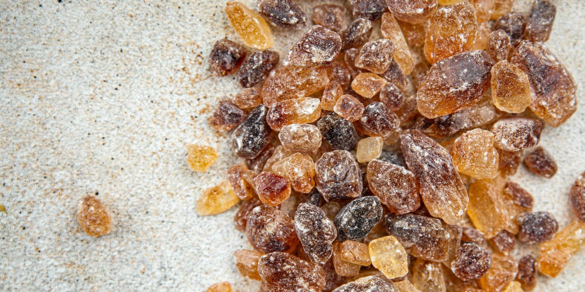 rock sugar crystals pieces candy brown sugar candied big rock caramel taste cane sugar healthy eating cooking appetizer meal food snack on the table photo