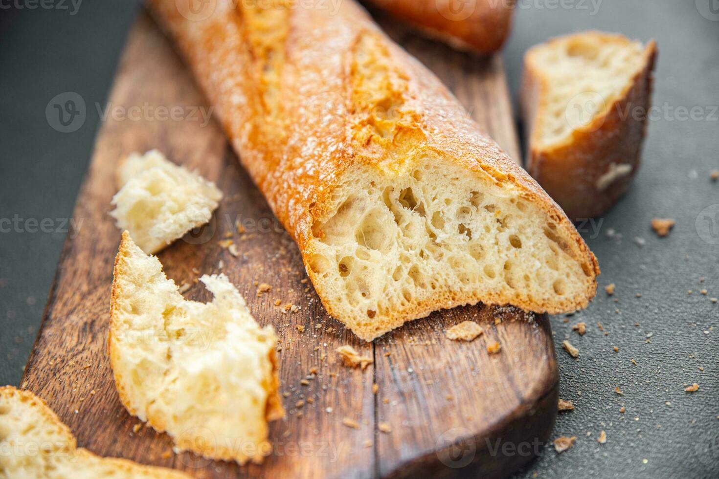tasty baguette fresh bread long bun snack appetizer meal food on the table copy space food background rustic top view photo