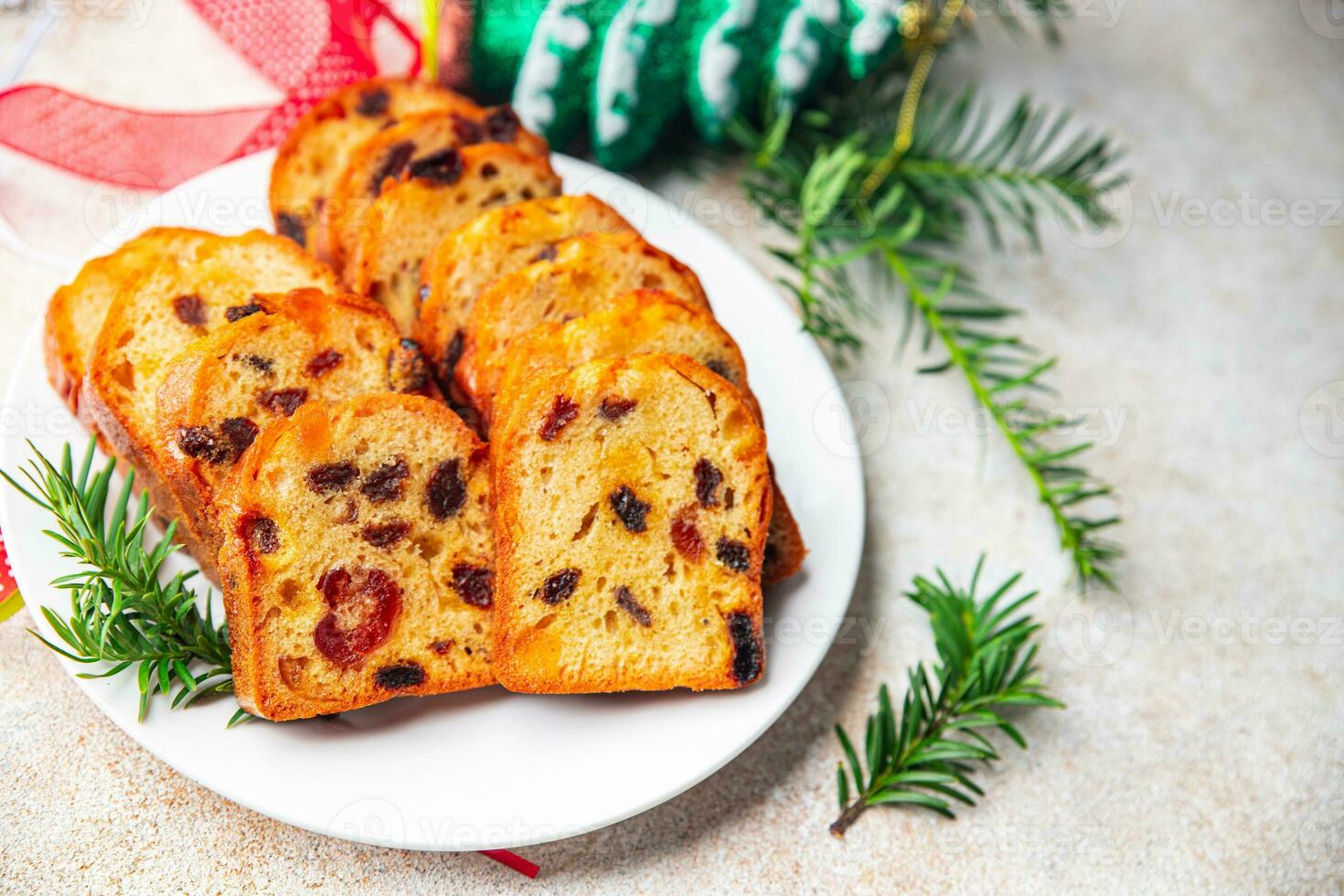 fruit cake sweet pastry dried fruits cherries, dried apricots, prunes, raisins Christmas sweet dessert holiday treat new year and christmas celebration meal food snack on the table photo