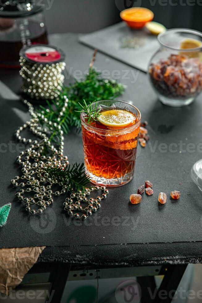 mulled wine christmas cocktail citrus and rosemary traditional drink new year holiday appetizer meal food on the table copy space food background rustic top view photo